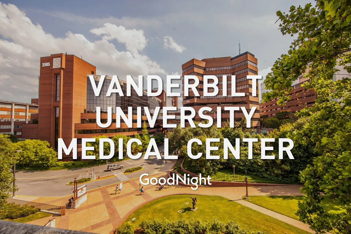 This image showcases the Vanderbilt University Medical Center building surrounded by landscaped gardens and pathways. The modern medical facility is complemented by greenery and open walkways, emphasizing accessibility and the presence of major healthcare institutions in Nashville.